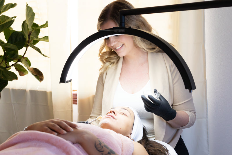 Client receiving facial treatment